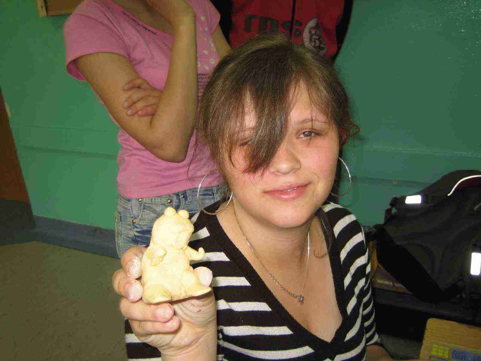 A student showing her artwork