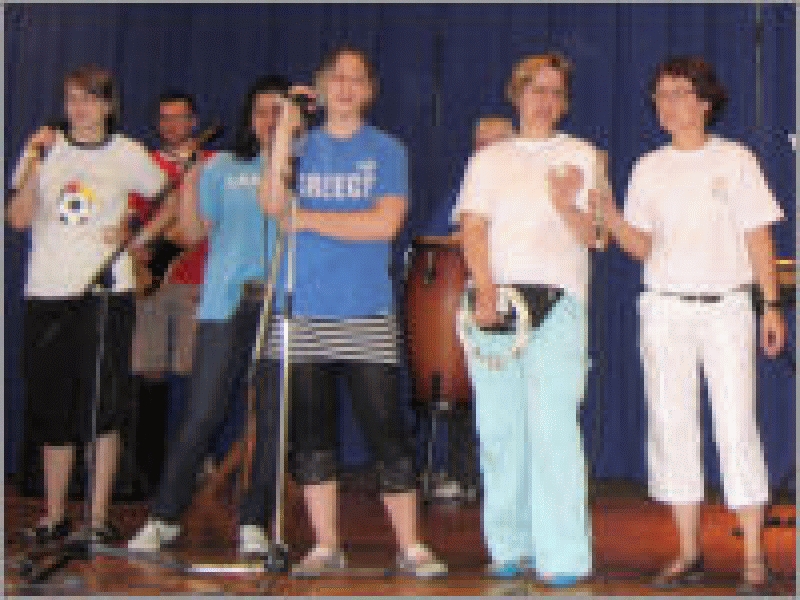 Pupils and teachers singing.