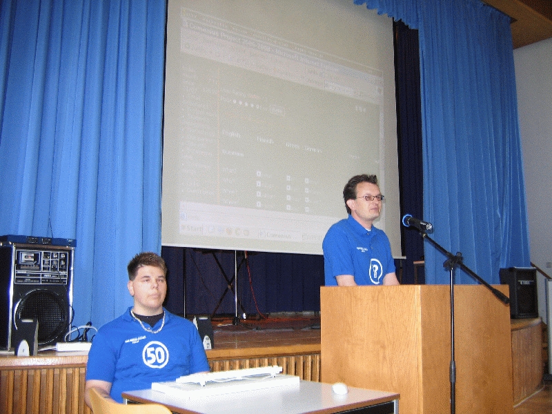 Ben and Michael presenting the distionary.