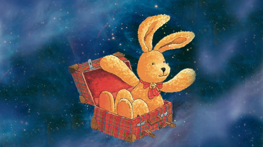 Felix sitzt in seinem Koffer und winkt. Im Hintergrund ist ein Sternenhimmel.