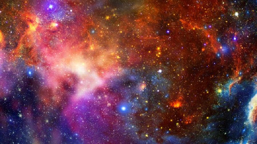 Blick in ein bunt eingefärbtes Weltall, eventuell handelt es sich um einen Nebel.