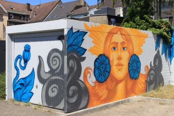 Fassadenmalerei in Herne: Wandgemälde an einer Garage in der "Straße des Bohrhammers", 2018.