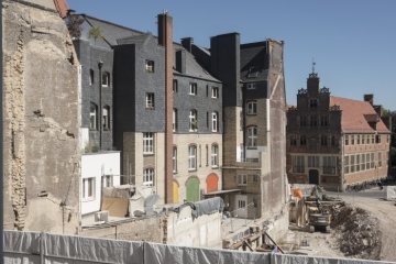 Bauliche Veränderungen in Münster: Blick auf die Baustelle des abgerissenen Textilgeschäfts Sinn Leffers, Salzstraße 56, und die umliegenden Häuser