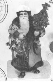 Darstellung des Weihnachtsmanns aus einer 'Weihnachtsuhr' aus Schwerte-Ergste (um 1920). <br>Foto: LWL</br>