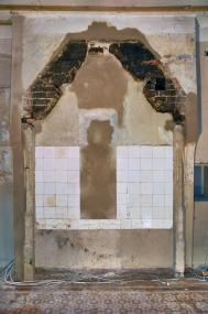 Hinter einer später eingezogenen Wand kamen die Reste von einem Wandkaminen zum Vorschein. <br>Foto: LWL<br />