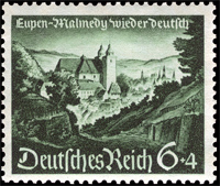 Briefmarkenausgabe des Deutschen Reichs, 'Eupen-Malmedy wieder deutsch', Blick auf Malmedy, 25.07.1940 / Quelle: Wikimedia Commons PD / Michel Junior-Katalog 1999, Deutsches Reich […], München 1997, S. 51 (Nr. 748)