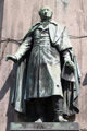 Köln, Heumarkt: Allianzfigur des Freiherrn vom Stein am Reiterstandbild für den preußischen König Friedrich Wilhelm III. (03.08.1770-07.06.1840, reg. 1797-1840) von Gustav Blaeser (09.05.1813-20.04.1874), nach dessen Tod fertiggestellt von Alexander Calendrelli (09.05.1834-26.05.1903) und Rudolf Schweinitz / <a href="http://www.gnu.org/licenses/fdl.txt" target="_blank">Wikimedia/GNU Free Documentation License/Raimond Spekking</a>